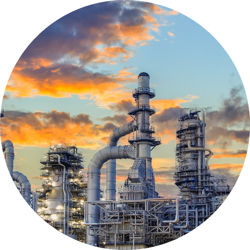 Factory chimneys against colorful clouds